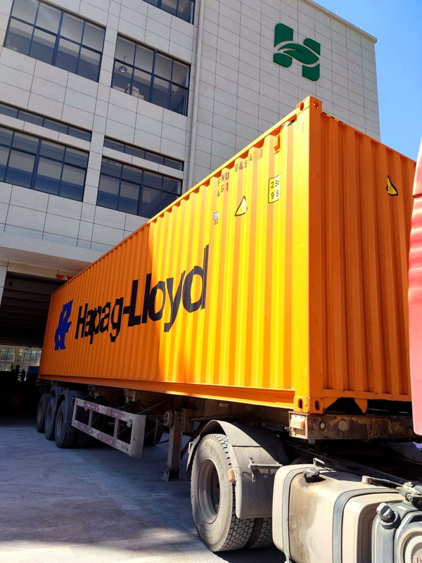 Shipping container at the HUGELEAF factory loading bay in Ningbo, China