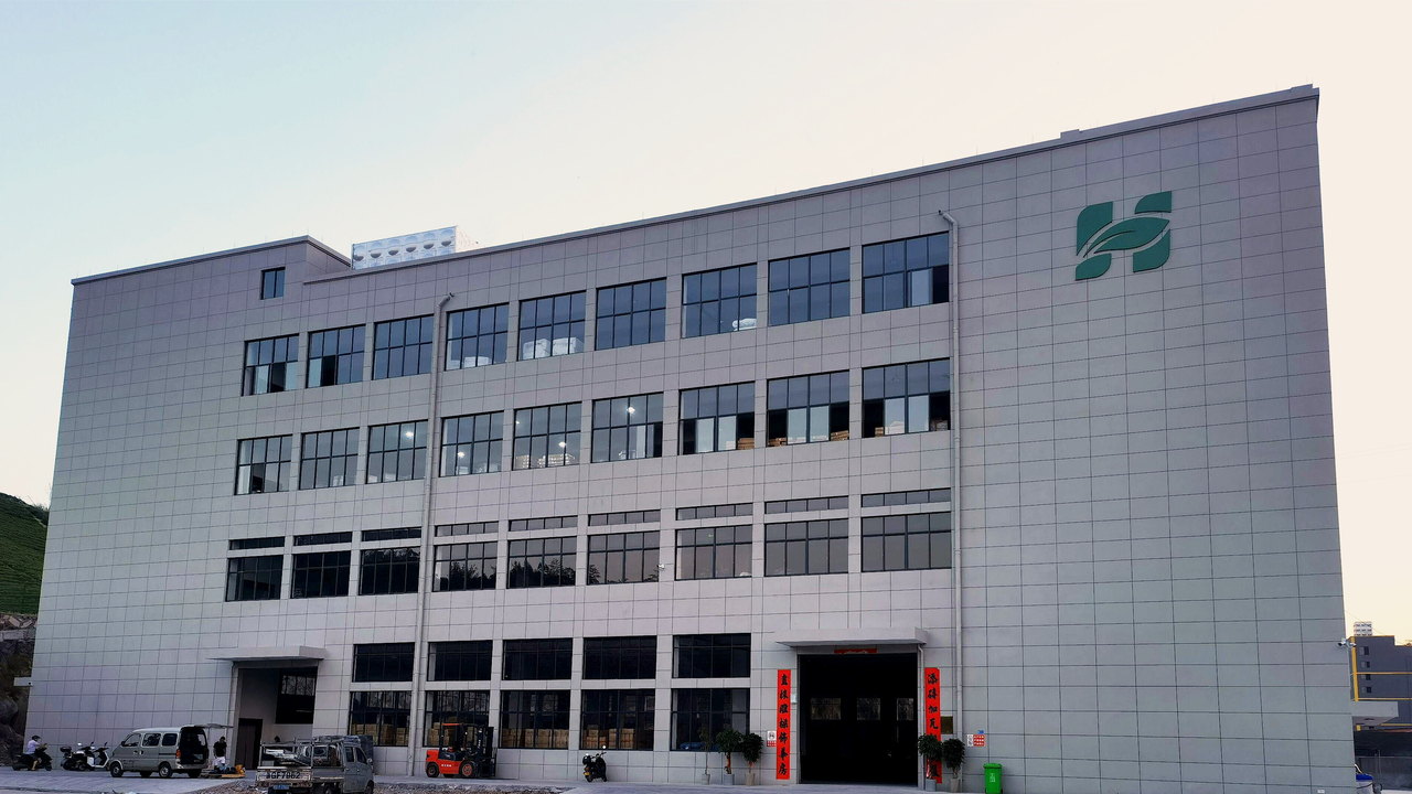 The HUGELEAF garden products factory in Ningbo, China, with the HUGELEAF sign on the building facade